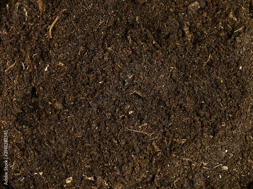 Potting soil, substrate used to grow plants in containers, top view, background