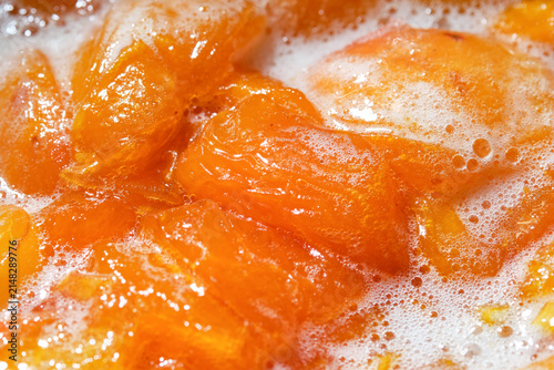 Freshly cooked, hot apricot jam. Cooking apricot jam with sugar. Apricots jam making process. Apricot Jam. Shallow depth of field.