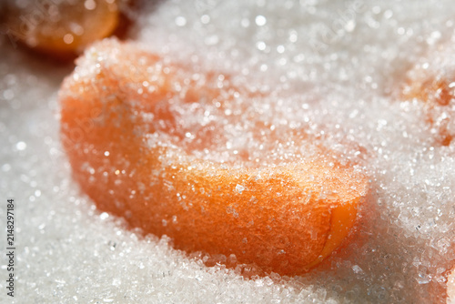 Cooking apricot jam with sugar. Apricots jam making process. Shallow depth of field. High sugar consumption.