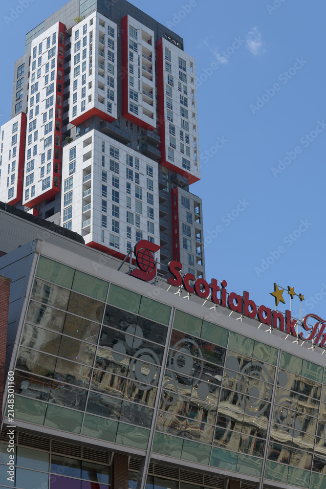 Fototapeta premium exterior building facade and sign of Scotiabank Theatre, a movie house, located at 259 Richmond St W, Toronto (behind: Picasso Condominiums)