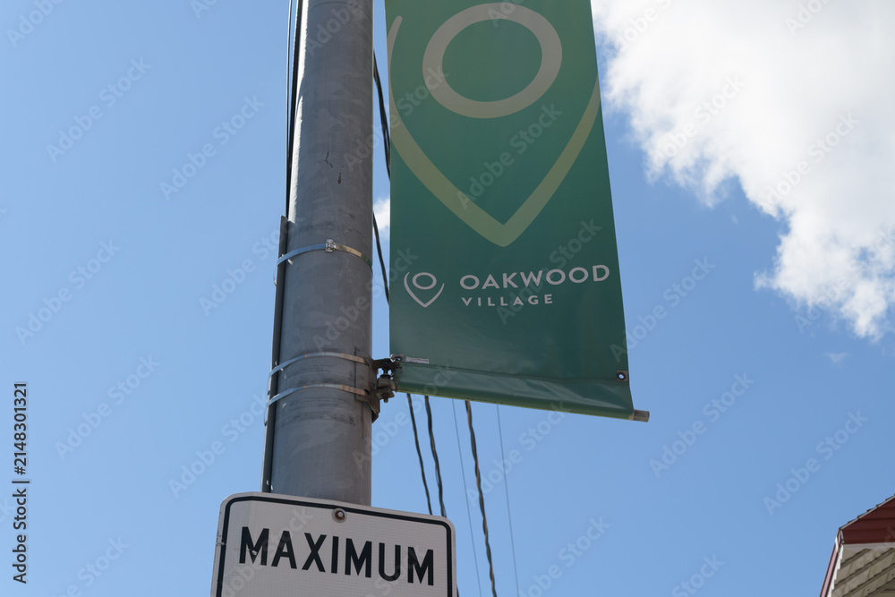 Fototapeta premium part detail of a BIA pole-mounted projecting banner at Oakwood Village (bounded by Eglinton Av W, Dufferin S, St Clair, Arlington Av/Vaughan Rd) Toronto