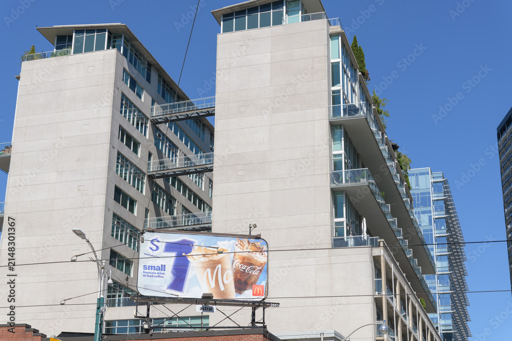 Fototapeta premium rooftop billboard for McDonald's Canada (summer beverages) and view of District Lofts (388 Richmond St W at Spadina Av) Toronto
