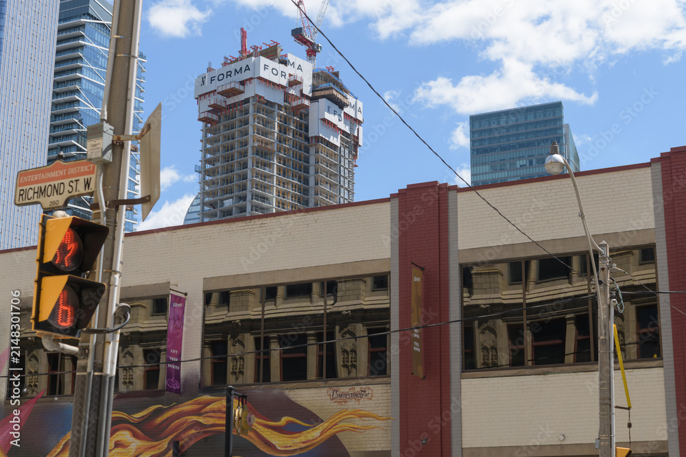Fototapeta premium exterior of The Ballroom Bowl, a bowling alley, located at 145 John St (seen here from Richmond St W) and FORMA Toronto Condos