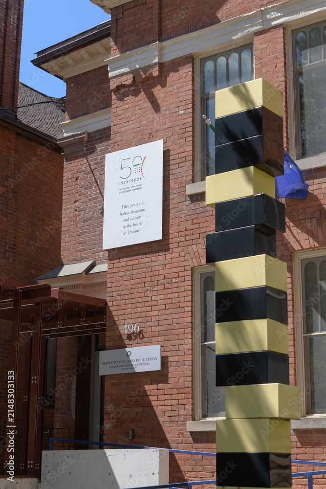 Fototapeta premium exterior building facade and signage of Istituto Italiano di Cultura (Italian Cultural Institute) located at 496 Huron St, Toronto - also “Torre Gialla Nera” or Yellow Black Tower by Bruno Billio