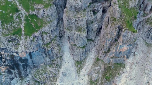 Aerial view of the rugged limestone cliffs and steep rocky slopes of the Dolomites in San Martino di Castrozza, Trentino-Alto Adige, Italy.