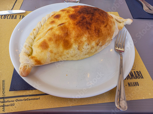 Принти на полотні Traditional Italian calzone with filling, classic Italian cuisine