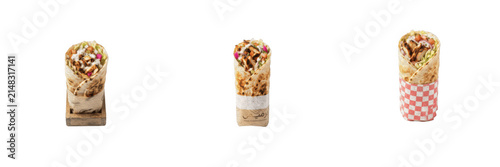 Delicious chicken shawarma wraps and burritos wrapped in paper, traditional middle eastern street food with meat and vegetables isolated on a transparent background for fast food design and menu promo