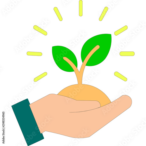 Human hand gently holding a small green plant sprout growing from soil with yellow rays of light