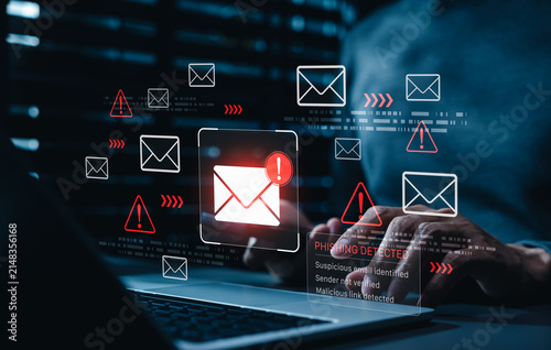 Phishing detection cybersecurity alert warns person about suspicious emails, unverified senders, and malicious links on laptop, fraud prevention, email security, threat monitoring and data protection