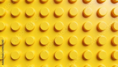Yellow LEGO brick surface with circular studs pattern
