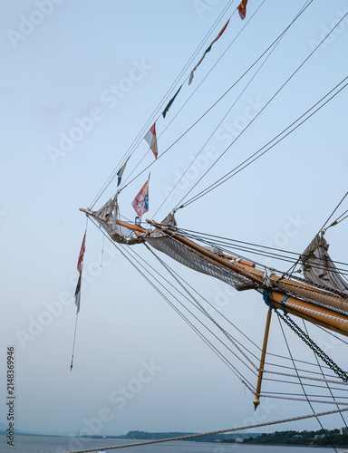 Canvas Print Wooden bowsprit of tall ship with nautical flags