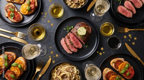 Dinner feast features savory steak and fresh bruschetta on a dark slate table.