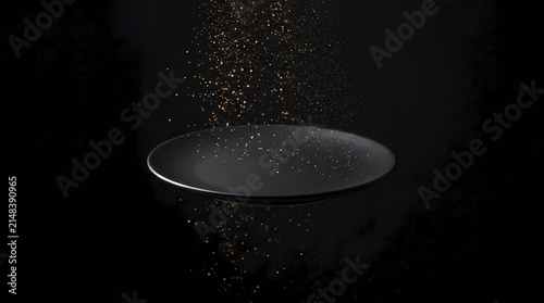 Floating matte black plate podium with magical glowing golden sparks falling from above