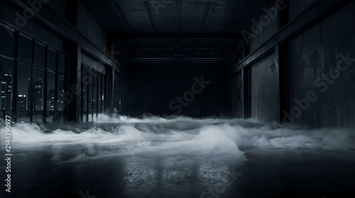 Dark industrial warehouse interior with dense white fog rolling on the concrete floor