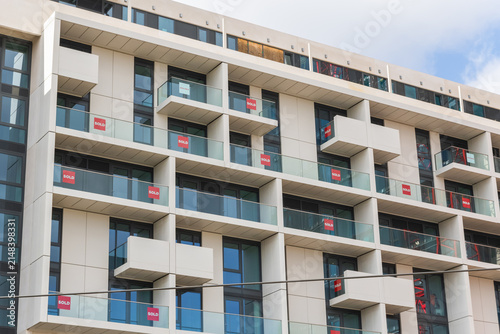 Photography Brand new empty apartments with sold and available signs around Finsbury Park in