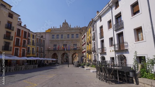 Wide view of Plaza Mayor with the arcaded city hall and surrounding buildings in Cuenca Spain