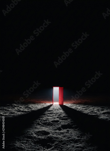 Open door with bright light on dark textured ground