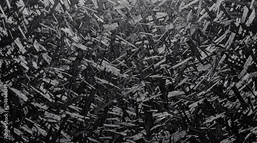 Forged carbon fiber composite plate showing random chopped pattern for premium motorsport and industrial design background