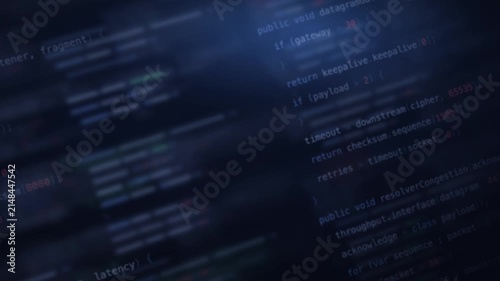 Blurred indigo network code background with glowing text elements, featuring soft focus on various programming snippets in shades of blue and green, creating a dynamic and tech-savvy atmosphere.