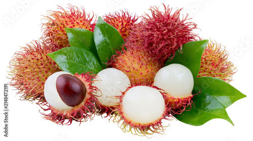 Fresh rambutan fruits with green leaves one peeled revealing white flesh and seed, isolated on transparent background