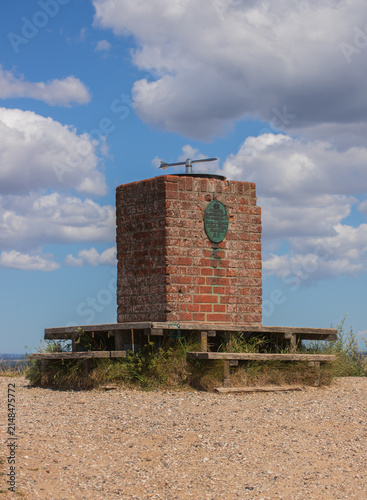 Historic stone pedestal with compass rose at Agri Bavnehøj in Denmark