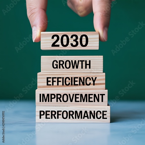 Hand placing wooden blocks with 2030 growth and performance
