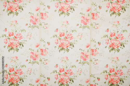 Old wallpaper on the wall. Old wallpaper for texture or background.