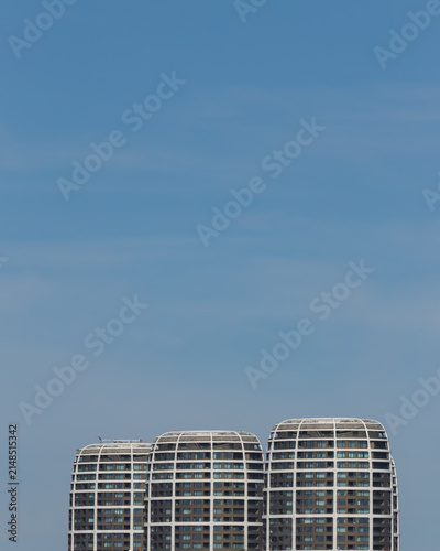 Konstfotografi A trio of modern residential and office buildings in a deep blue sky