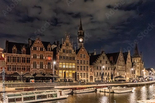 Illuminated Historic Guildhalls and Canal View at Night in Ghent, Belgium