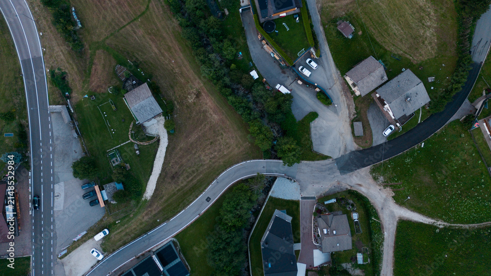Obraz premium Aerial view of rural road, road junction in a mountain village