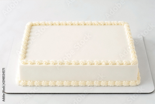 Blank white rectangular sheet cake mockup with piped buttercream border. Empty frosted celebration template with copy space for custom birthday message and bakery branding.