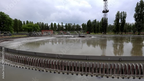 Round wastewater purification tanks at modern sewage treatment plant.
