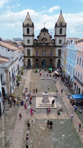 Aerial view of the historic Igreja de Sao Francisco and the surrounding cobblestone square in Pelourinho with people walking, Salvador, State of Bahia, Brazil.