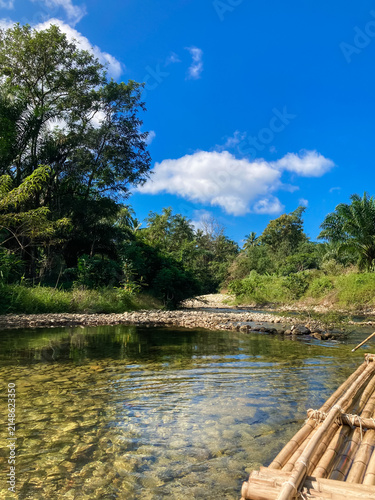 wooden bridge over lake in phang-nga thailand