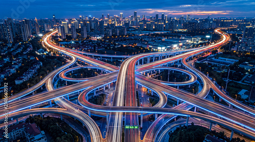 Aerial view of a complex highway interchange at night in a modern city