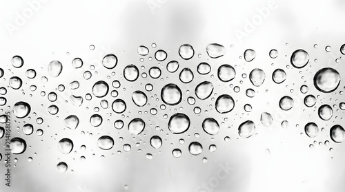 Horizontal band of water droplets on glass background with droplets, transparent