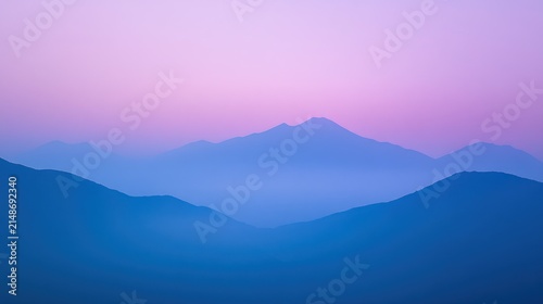 Misty mountain range at dawn.