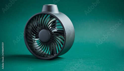 Compact Industrial Turbomachine Fan Rotor Against Green Background.