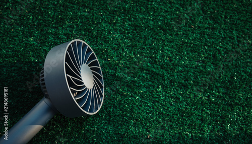 Close Up Sprinkler Head Over Fresh Green Lawn.