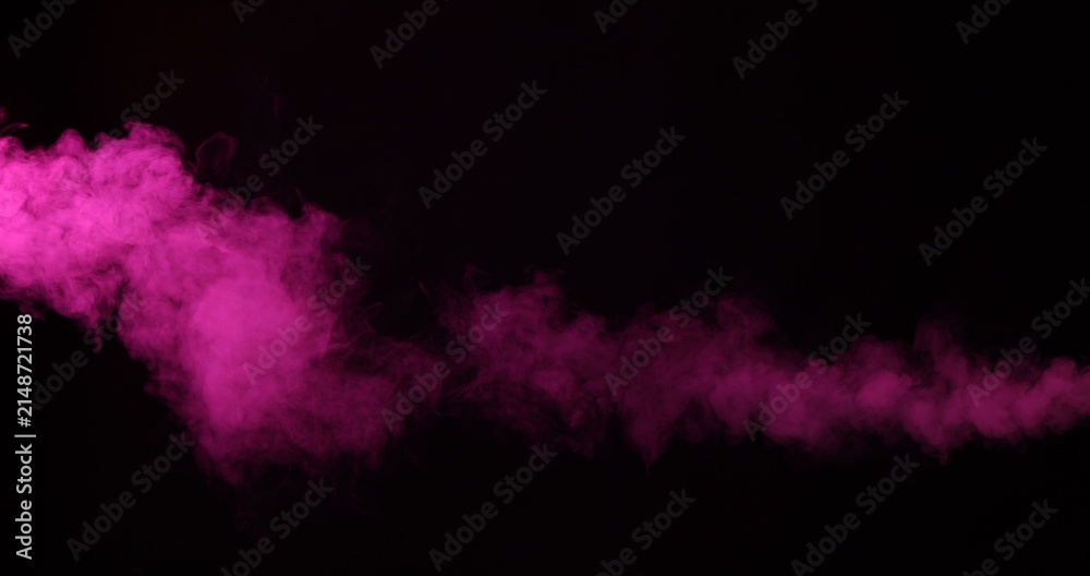 Obraz premium Beautiful smoke in neon light on dark background