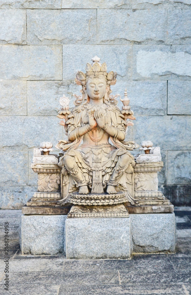 Fototapeta premium Traditional stone Buddha statue at Ksitigarbha Bodhisattva Temple or Patung Seribu in Tanjung Pinang Bintan Island Indonesia