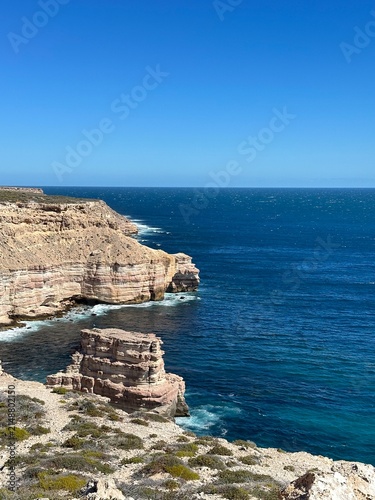 Cuadro en lienzo Dramatic rugged sea cliffs overlooking crystal clear turquoise ocean waters at I
