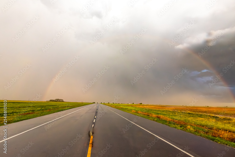 Obraz premium Rainbow After the Storm. Climate Change, Extreme Weather, Supercell Storms, Environmental Sustainability and Hope for a Changing Planet
