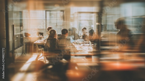 Blurred view of people in a meeting room with warm lighting
