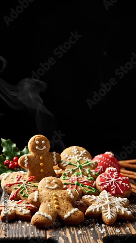 Festive Gingerbread Cookies With Steam Rising on a Rustic Wooden Table for Christmas Celebration