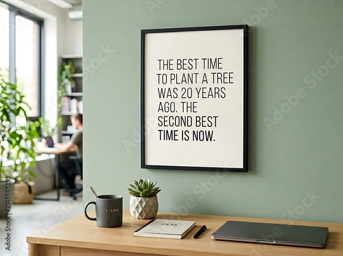 Inspirational quote poster in modern office space.