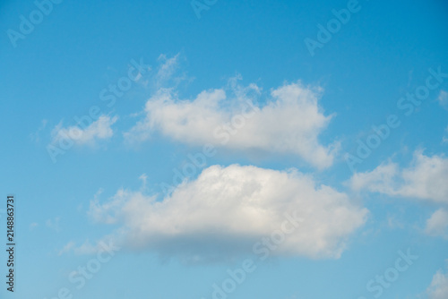 Fotografie Cumulus clouds that look fluffy and hang in the bright blue sky