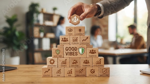Stack of cardboard boxes with good vibes message in room