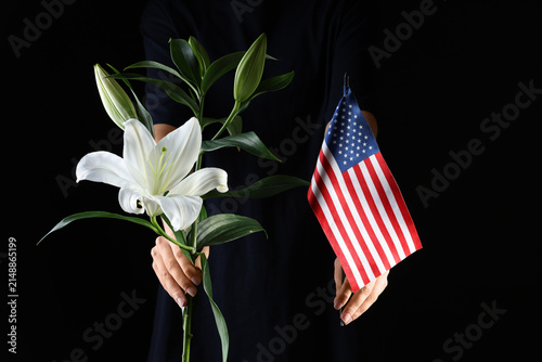 Person holding a white lily...