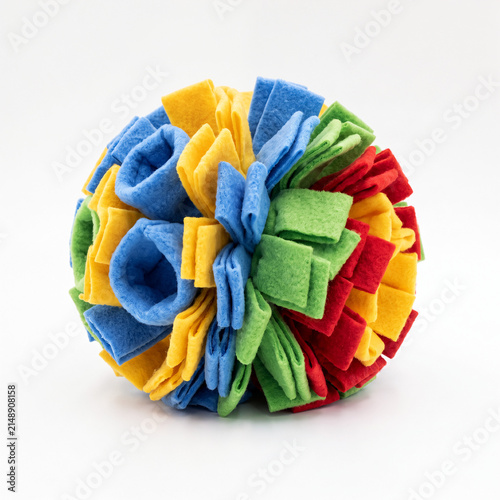 Generic soft fleece dog snuffle ball foraging toy isolated on white.